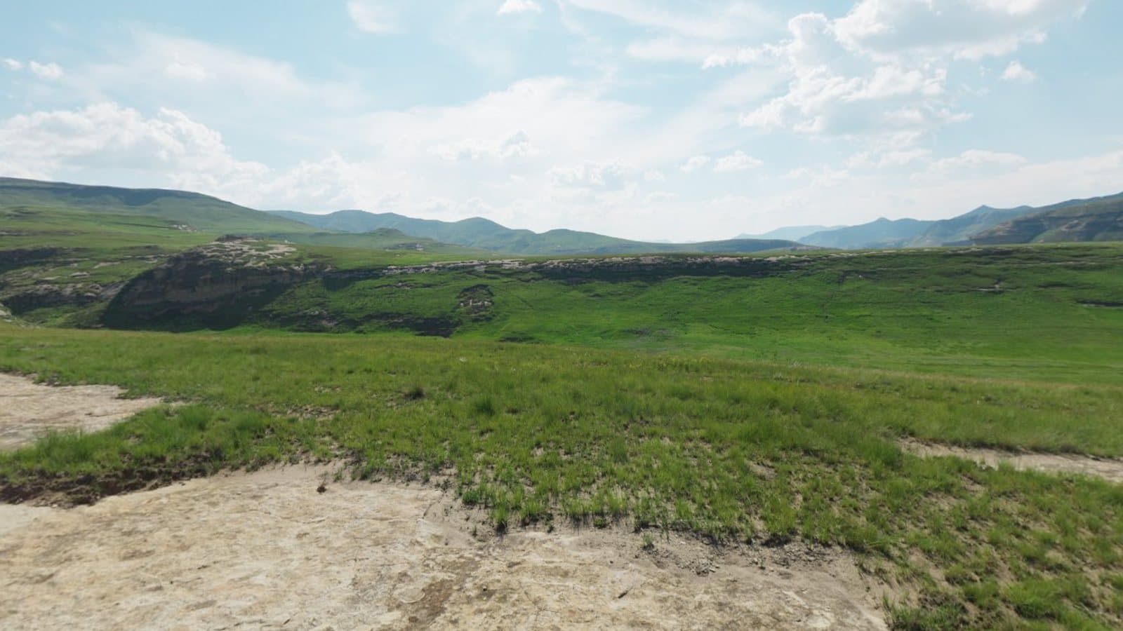 Sample 360 degree panorama of green hills under a blue sky