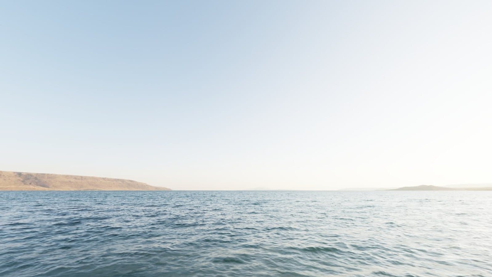 Calm water under a clear sky, a simple scene for practising panoramic composition