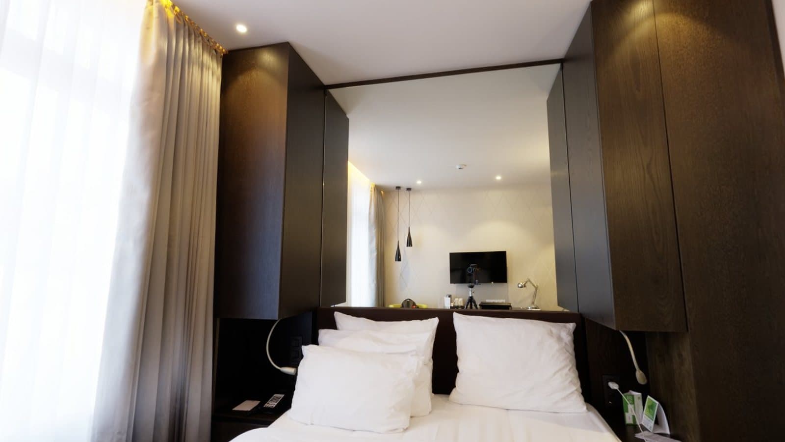 A hotel bedroom with a large bed