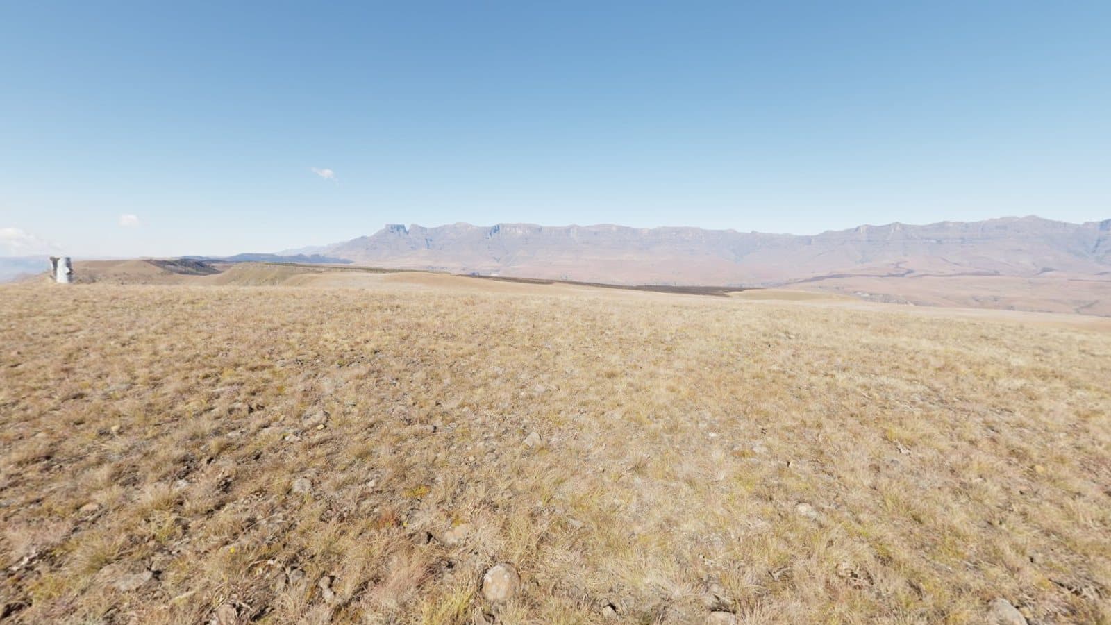 A wide mountain landscape with a large sky, typical sky and ground content of a spherical panorama